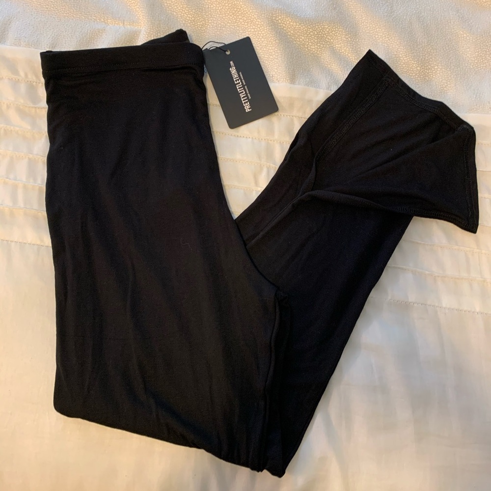 Pretty Little Thing black split leggings NWT